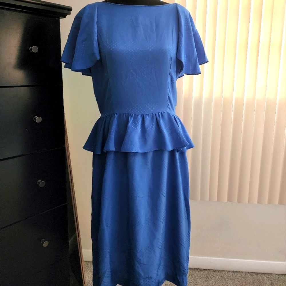 Periwinkle blue peplum midi dress. 100% polyester.